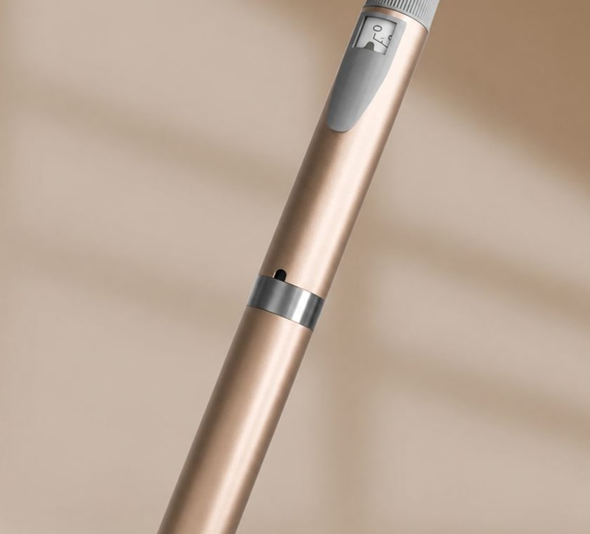 The Aevum injector pen, a reusable click-to-dose pen with a dose window and dial ring.